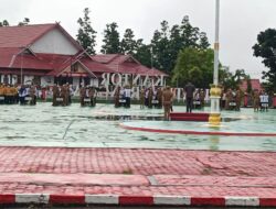 Diguyur Hujan Peserta Apel Hardiknas Tetap Antusias